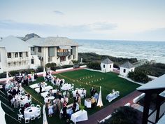 an aerial view of a wedding reception on the lawn