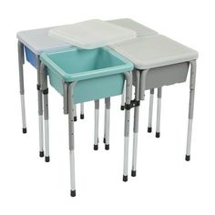 three children's desks with one blue and one white tray on each side