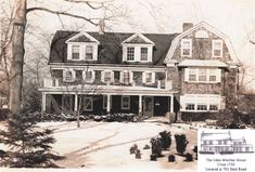 an old black and white photo of a house in the snow with trees around it