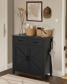 a black cabinet with two baskets on top