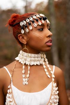 This Halimato Cowry Shell Necklace Set is One Necklace and a pair of earrings. You can stack two or more to achieve statement look or wear necklace as a headpiece- see model photos Afro Jewelry, African Women Painting, African Jewellery, Beaded Headpiece, African Beads Necklace, Afrocentric Fashion, Cowry Shell, African Accessories, Hair Jewels