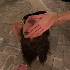 a woman is upside down on the ground