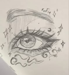 a drawing of an eye with stars around it