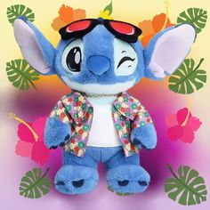 a blue stuffed animal with sunglasses on it's head