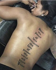 the back of a woman's body with words written on it and an inscription that reads