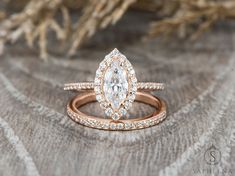 an engagement ring with a pear shaped diamond in the center