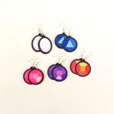 Made with faux leather and vinyl these crystal gem earrings are so lightweight, comfy, and versatile. Handcrafted in my home studio with original designs they are sure to be great addition to any style! *Follow the process and get to know me better: https://linktr.ee/maxrigby13 Find more in my shop: https://www.etsy.com/shop/rigbydesignsshop *Color Disclaimer* Colors may vary depending on the settings of your screen. Steven Universe Jewelry, Steven Universe Crystal Gems, Get To Know Me Better, Crystal Gems Steven Universe, Gem Earrings, Crystal Gems, Home Studio, Steven Universe, Favorite Jewelry