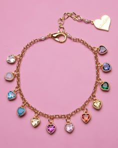 This Rainbow Heart Bracelet will put a smile on anyone's face! With its bright and colorful design, it's sure to take your heart on a joy ride—and with no curbs! A perfect way to brighten any day. Materials: 18K Gold Plating, Cubic Zirconia, Stainless Steel. Hypo-allergenic.Length: 6" Bracelet with 1" extension chain (Sizes Available)Pendant Dimensions: 6mm Care: Our jewelry is designed to be water-resistant, so you don't have to worry about taking it off when you're near water. However, we reco Colorful Charm Bracelet, Rainbow Jewelry Diy, Barbiecore Jewelry, Valentine’s Day Jewelry, Colorful Jewelry Aesthetic, Kawaii Bracelets, Bisexual Jewelry, Take Your Heart, Lover Accessories