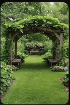 a wooden bench sitting in the middle of a lush green park