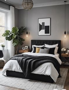 a bedroom with grey walls and white bedding