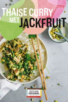 a bowl filled with rice and vegetables next to chopsticks on top of it