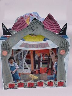 an altered photograph of two children in front of a fake house with hands and feet sticking out