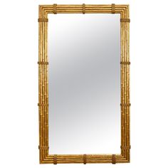 a mirror that is made out of bamboo