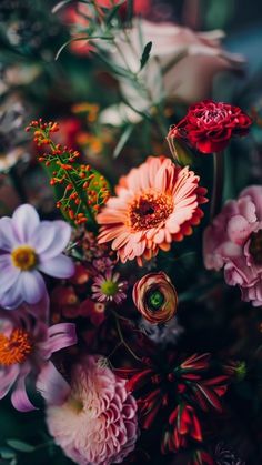 a bunch of flowers that are sitting on a table