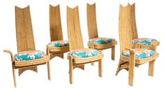 four chairs with matching cushions are shown side by side in the same pattern and color