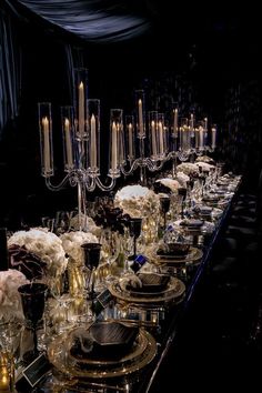 a long table is set with candles and flowers for a formal dinner or party event