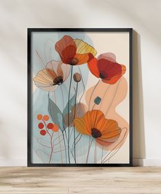 an art print with orange and red flowers on the wall next to a wooden floor