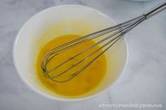 an image of eggs being whisked in a bowl on the counter top with other ingredients