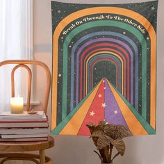 a room with a chair and a large poster on the wall that says, the rainbow tunnel