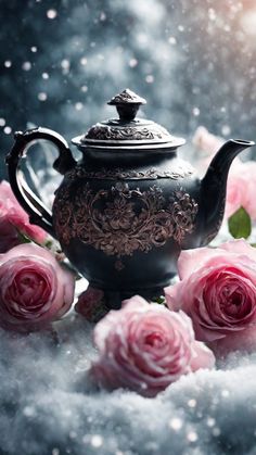 a black teapot with pink roses on it and snow falling down behind it in the background