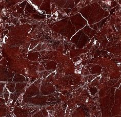 red marble with white veining on it