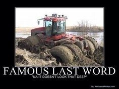 a tractor that is sitting in the dirt with words on it saying, famous last word natt doesn't look that deep