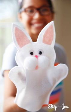 a close up of a person holding a stuffed animal