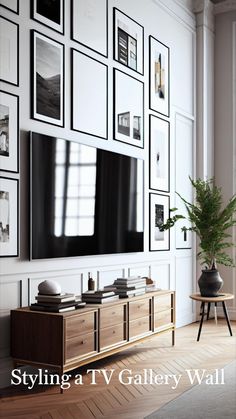 a large television mounted to the side of a wall with many framed pictures on it