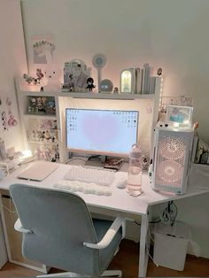 a white desk with a computer monitor and keyboard