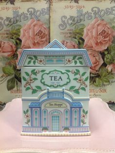 there is a small tea box with roses on it