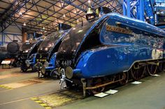 an old fashioned train is on display in a museum