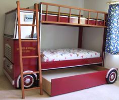 a red bunk bed sitting in the middle of a room next to a ladder and window