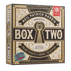 the box two card game is open to reveal its contents and features an image of a key