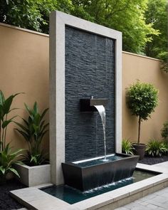 an outdoor fountain with water flowing from it