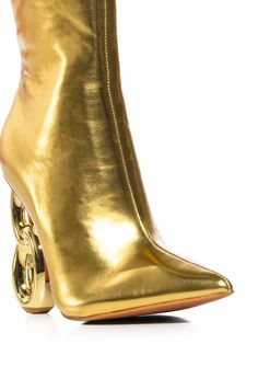 Chain links and champagne clinks. Celebrate the good life in The AZALEA WANG Rimini Gold Chain Heel Bootie. This pointy toe ankle boot features a metallic faux leather upper, a reflective, chain link-inspired heel, and tonal inner ankle zipper closure. Style with straight leg denim and an oversized button down for a chic look. (all measurements approximate from size 7.5) - Faux Leather Upper - Pointed Open Toe - Novelty Heel - 4.5” Heel Height - 5.5” Shaft Length - 11.25” Shaft Circumference - Imported Product ID: 367073 Azalea Wang, Chain Links, The Good Life, Straight Leg Denim, Rimini, Good Life, Gold Chain, Chain Link, Gold Chains