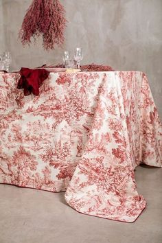 a red and white table cloth on top of a table