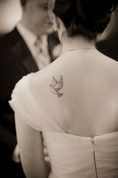 a woman with a tattoo on her back