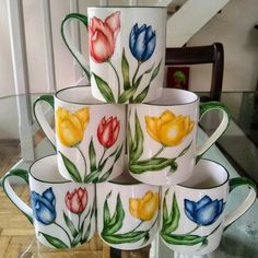 a stack of coffee cups sitting on top of a table