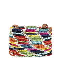 a multicolored handbag with leather handles