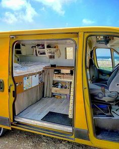 the interior of a yellow van with its door open