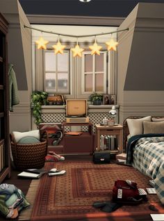 a bedroom with three stars hanging from the ceiling and other items on the floor in front of it