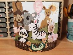 an animal themed birthday card on a desk