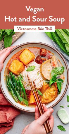 vegan hot and sour soup in a bowl with chopsticks on the side