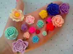 there are many different colored flowers on this hand