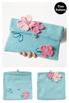 a hand holding a blue purse with pink flowers on the front and side, while another is