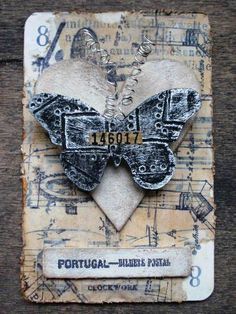 an altered photo of a butterfly on a piece of paper with the words portugal written in it