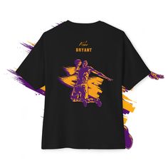 a black t - shirt with an image of a basketball player in purple and yellow