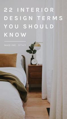 a bed sitting next to a window with the words 22 interior design items you should know