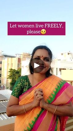 a woman wearing an orange and pink sari with the words let women live freely, please