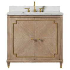 a bathroom vanity with marble top and gold accents